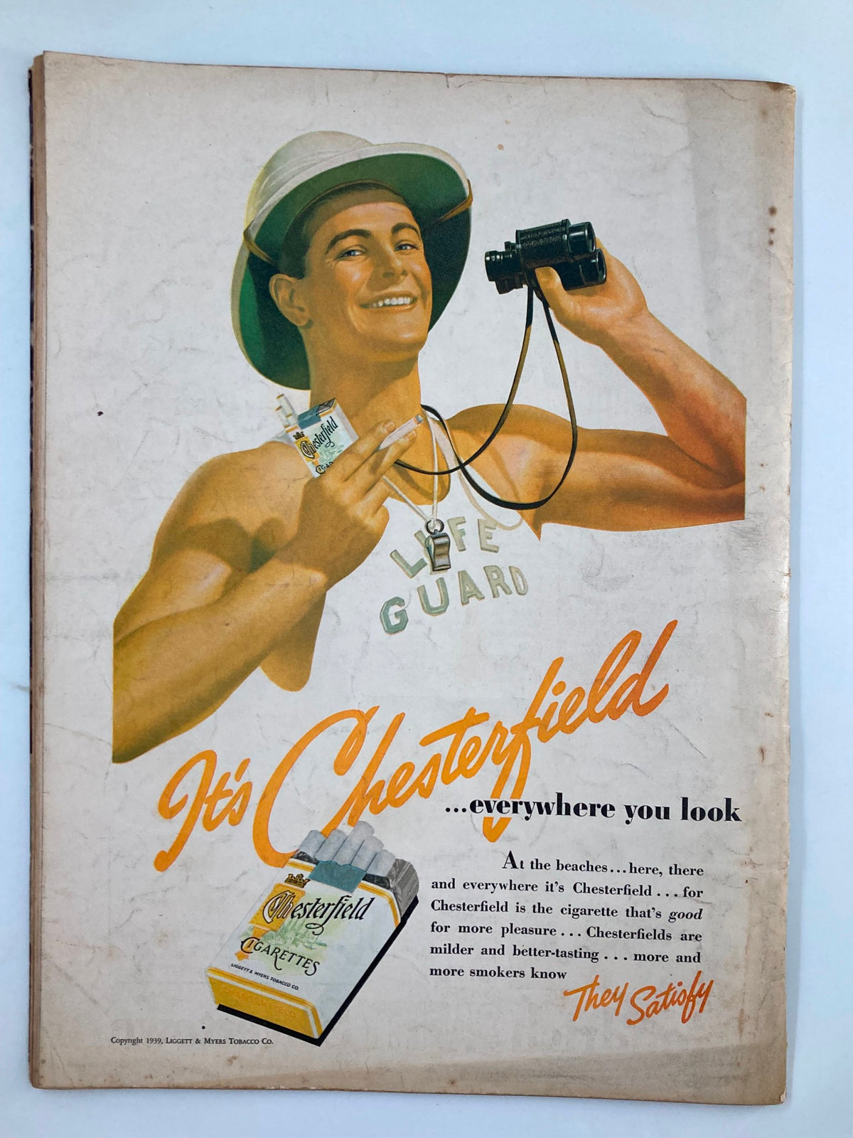 Back cover of the VTG Liberty Magazine August 5, 1939 promoting Chesterfield cigarettes with an illustration of a smiling lifeguard holding binoculars.