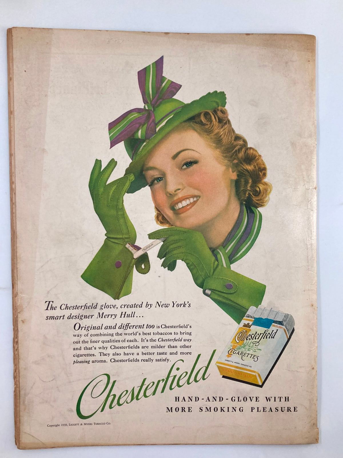 VTG Liberty Magazine May 13 1939 advertisement for Chesterfield cigarettes, showcasing a smiling woman wearing a green hat and gloves, illustrating vintage advertising style and cultural context from the 1930s.