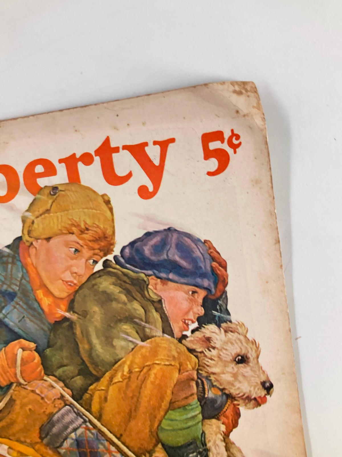Close-up view of the cover of VTG Liberty Magazine January 20 1940 highlighting two children and a dog sledding, showcasing the vintage artwork and title details.