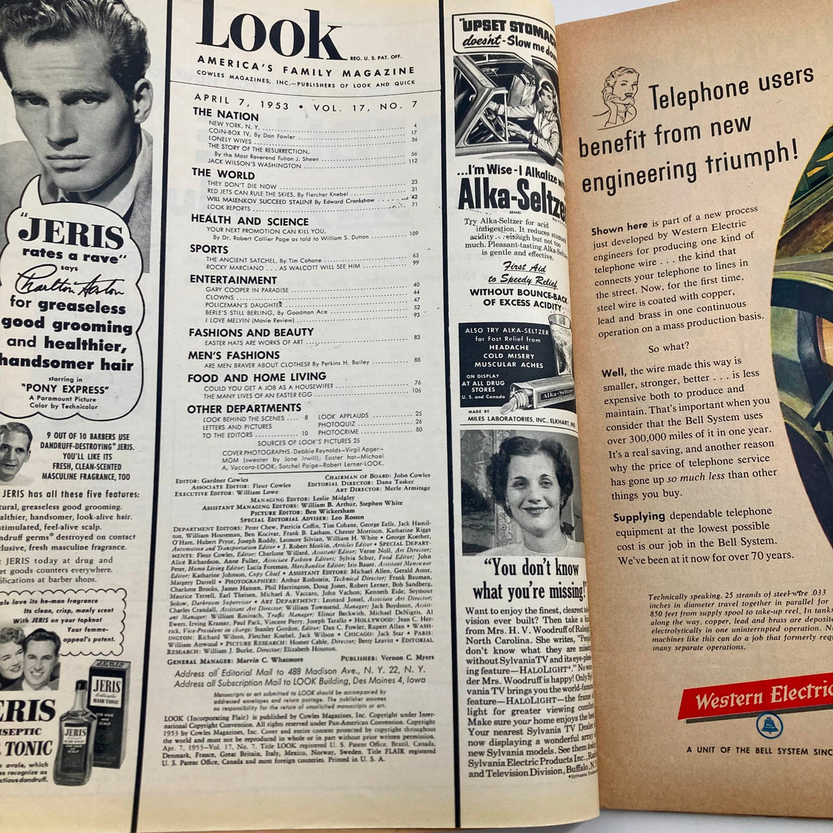 Inside view of Look Magazine, April 7, 1953, showcasing content headlines and advertisements featuring Debbie Reynolds and Satchel Paige.