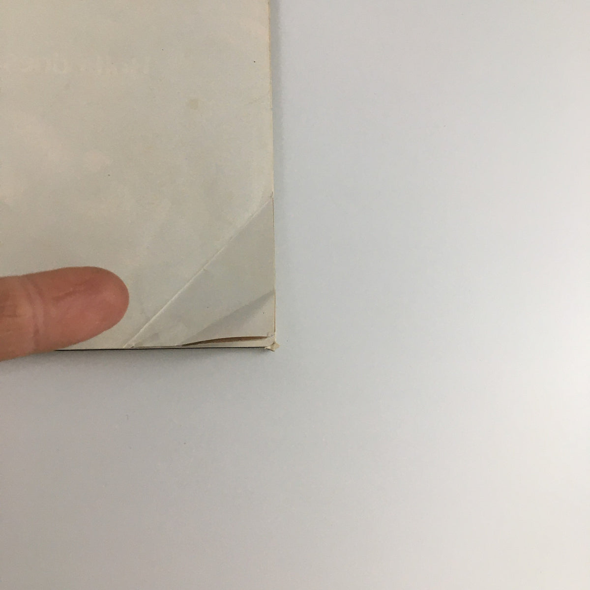 Close-up of the corner of the 1972 Playbill for 'The Lincoln Mask' showing minor wear and creases.
