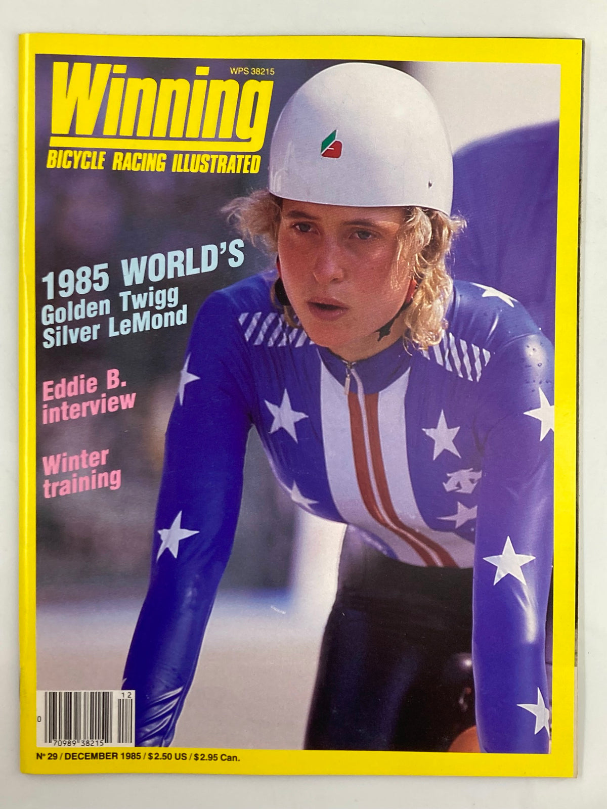 Cover of VTG Winning Bicycle Racing Illustrated December 1985, featuring Rebecca Twigg in a cycling helmet and outfit with stars and stripes, highlighting her significance in women's cycling.