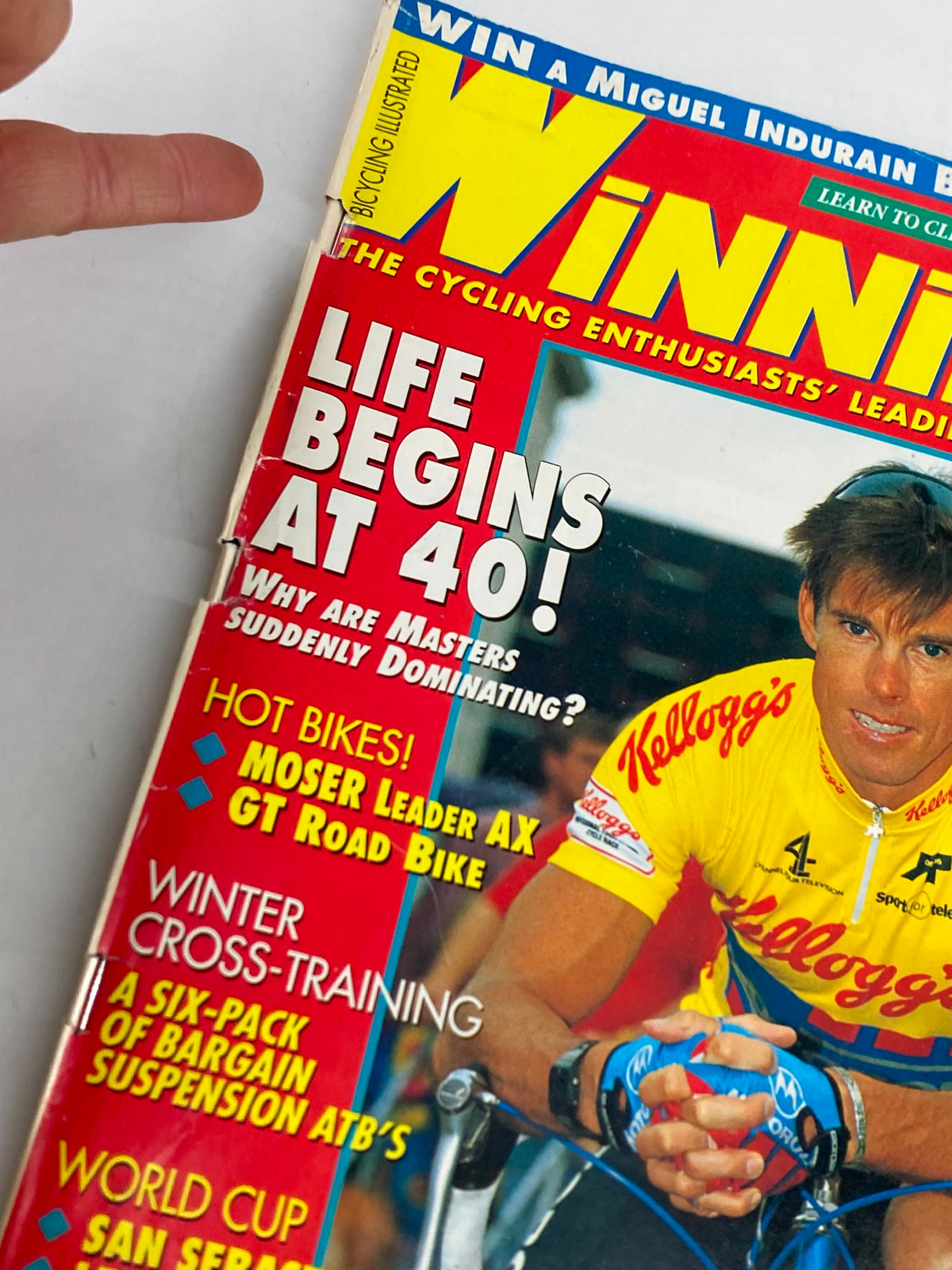Close-up of the cover of Winning Bicycle Racing Illustrated, October 1993 issue #117, highlighting Phil Anderson in a Kellogg's racing jersey, emphasizing articles on cycling and sports.