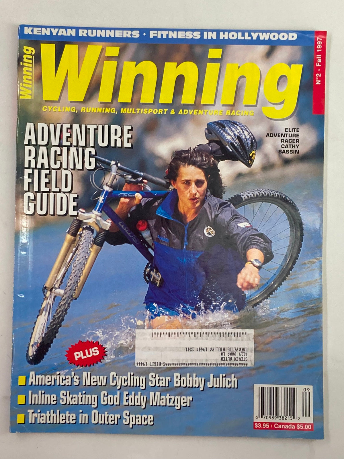 Cover of Winning Bicycle Racing Illustrated, Fall 1997, Issue #2 featuring adventure racer Cathy Sassin, highlighting adventure racing and cycling sport.