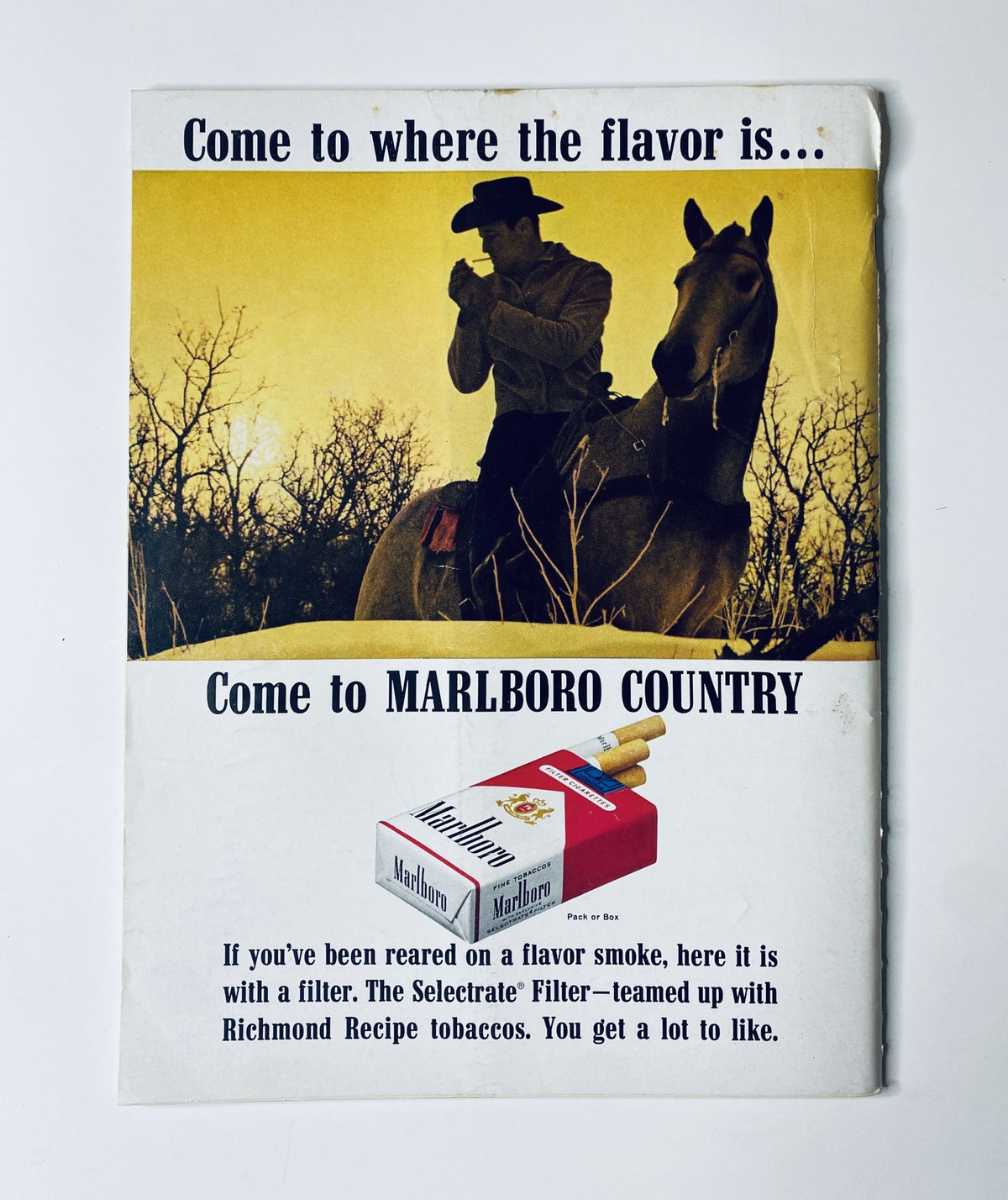 Marlboro advertisement featured in The New Yorker Magazine February 22, 1964, promoting Marlboro Country with a cowboy on horseback.
