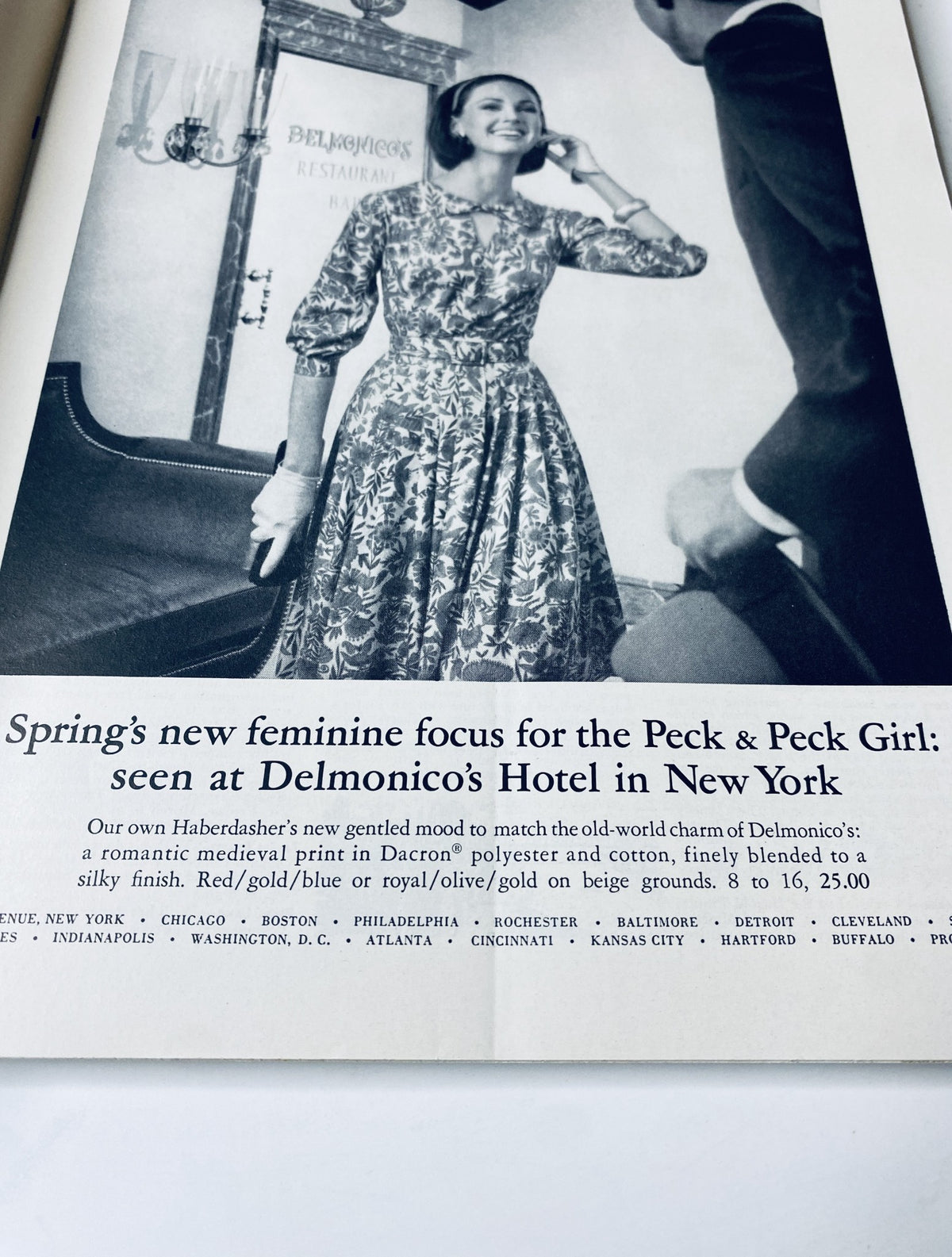 Advertisement in The New Yorker Magazine March 7, 1964, for Delmonico’s Restaurant featuring a woman in a floral dress, promoting spring fashion for the Peck & Peck Girl.