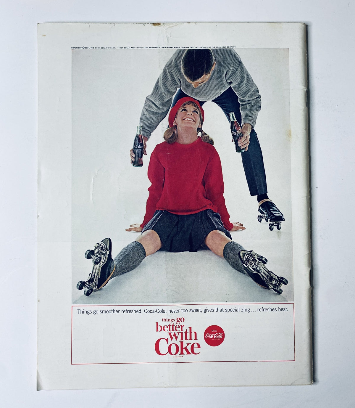 Advertisement in The New Yorker Magazine February 1, 1964 showcasing Coca-Cola, featuring a woman in a red outfit enjoying a soft drink while roller skating.