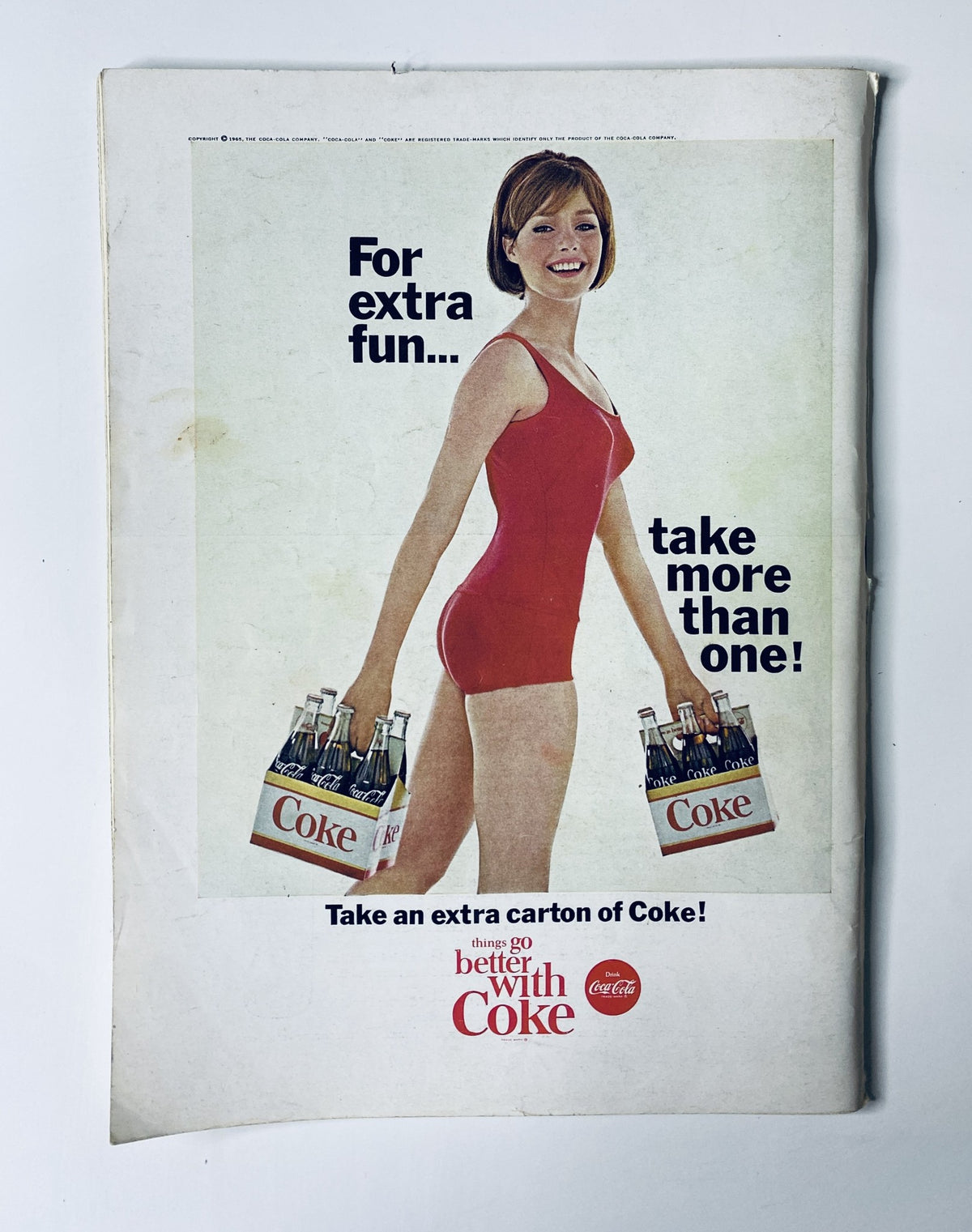 Back cover advertisement from The New Yorker Magazine June 19, 1965, featuring a woman in a red swimsuit promoting Coca-Cola with a playful tagline.