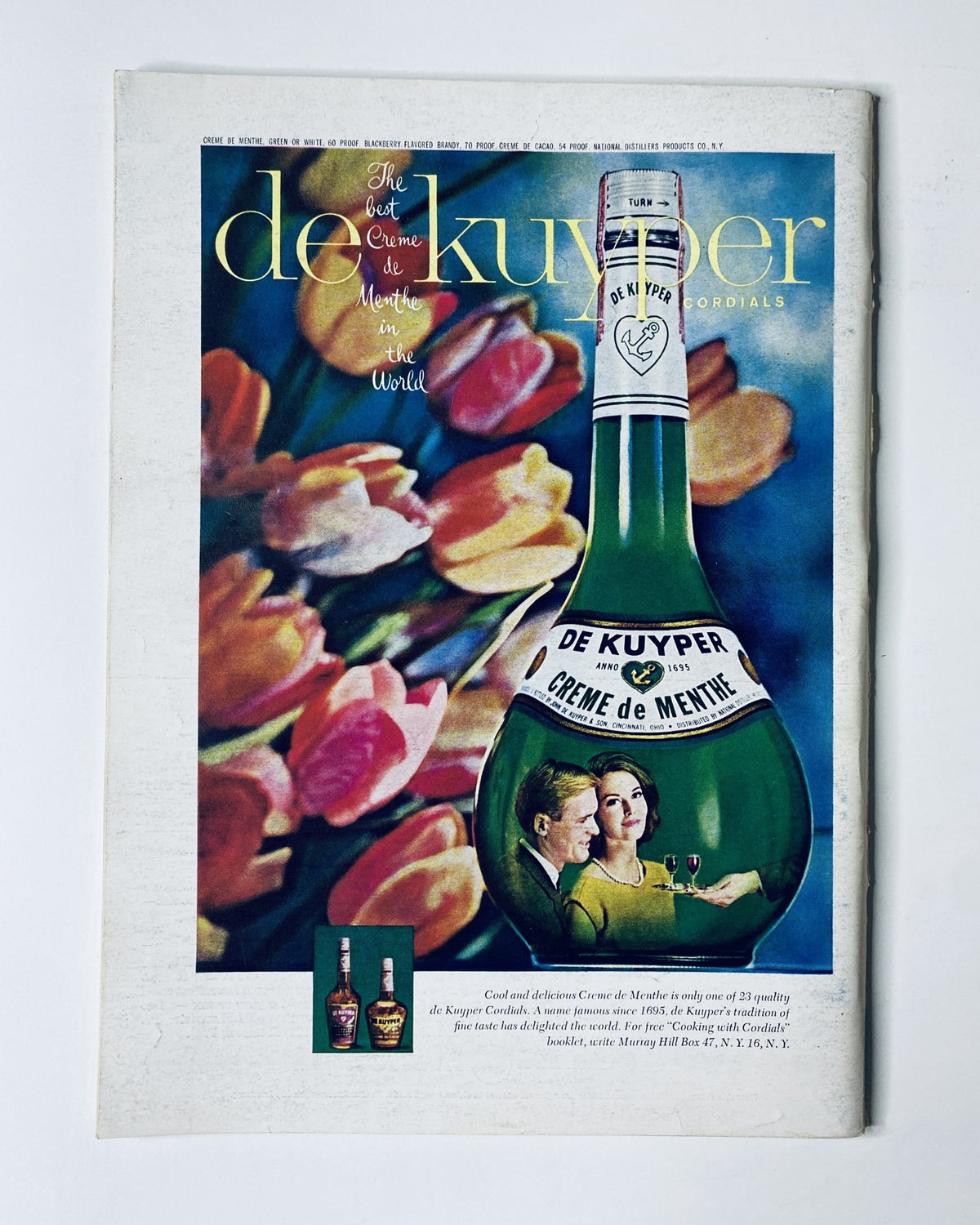 Vintage advertisement page from The New Yorker Magazine February 6, 1965, featuring a colorful De Kuyper liqueur ad, depicting a bottle of crème de menthe surrounded by tulips and a couple enjoying the drink.