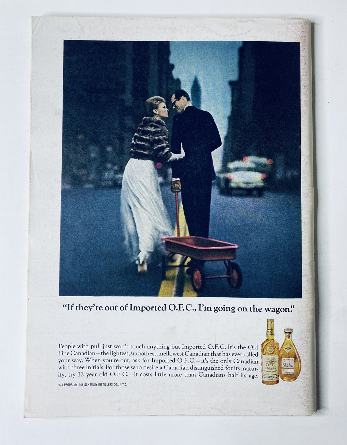 Back cover of The New Yorker Magazine April 10, 1965 featuring an advertisement for Old Fine Canadian whiskey, highlighting an elegant couple in a city setting.