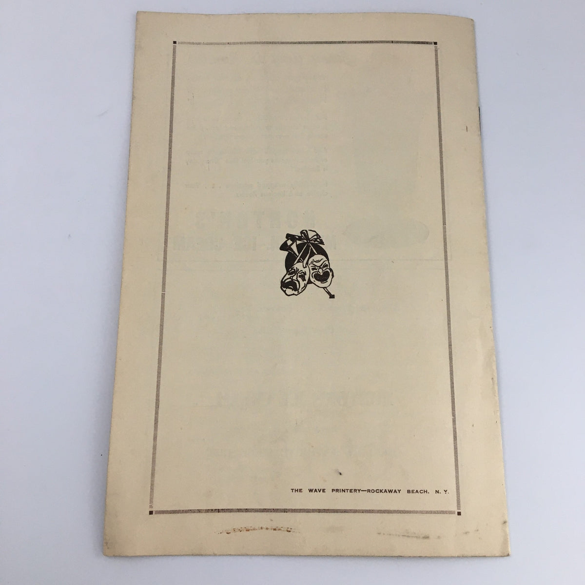 Back cover of the program for the 1941 Far Rock Away High School Play 'Margin for Error' featuring a design with theatrical masks.