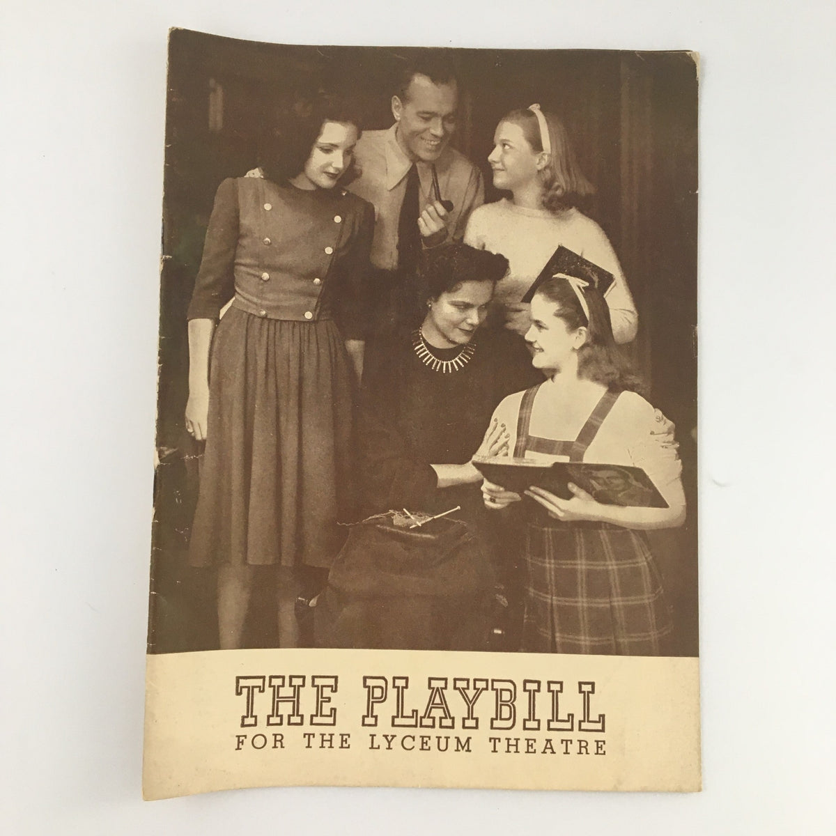 1942 Playbill for the Lyceum Theatre featuring the cast of 'Junior Miss', showcasing five actors in a nostalgic black-and-white photograph.