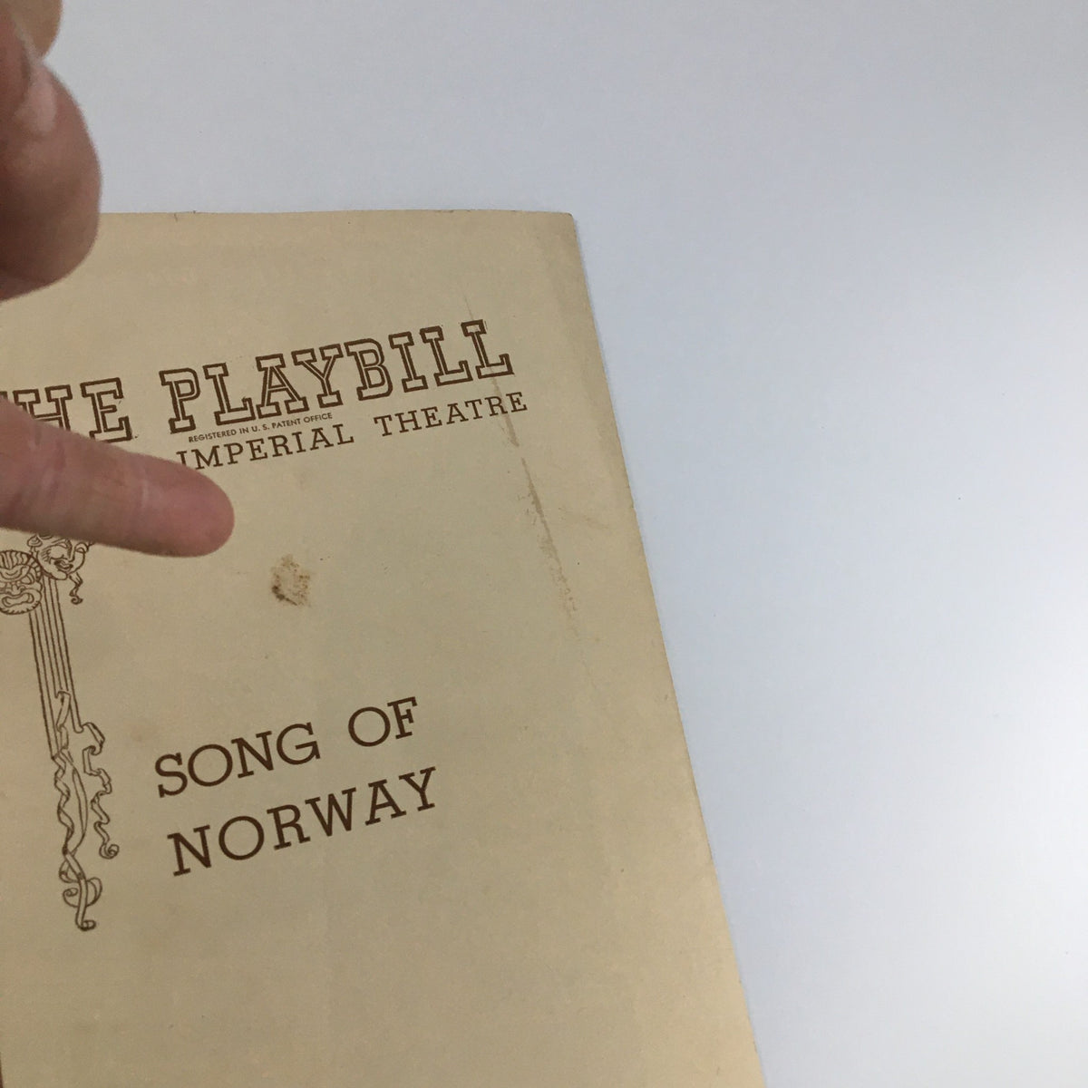 Close-up of the 1945 Playbill for 'Song of Norway' at the Imperial Theatre showing the title and some wear on the cover.