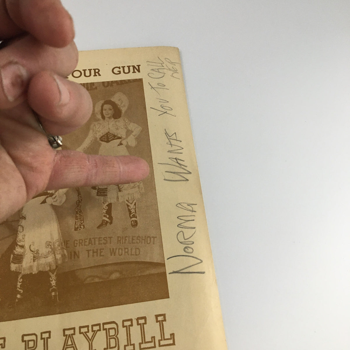 Close-up of the 1946 'Annie Get Your Gun' Playbill showing handwritten notes next to the cover image.