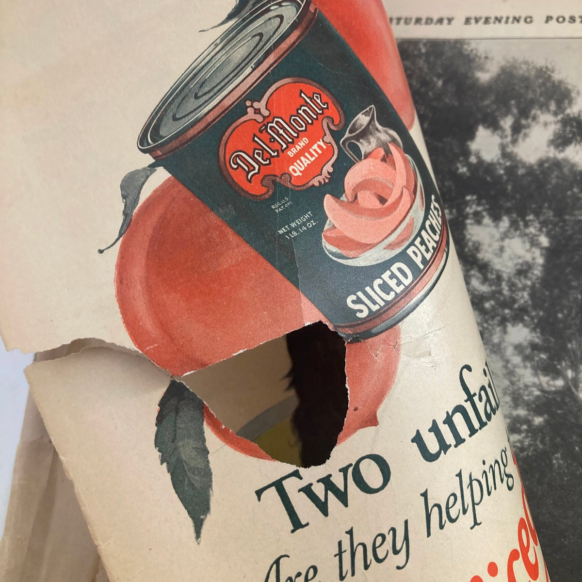 Close-up detail of a vintage advertisement for Del Monte sliced peaches featured in The Saturday Evening Post Magazine June 19, 1926. Shows the historic packaging design.