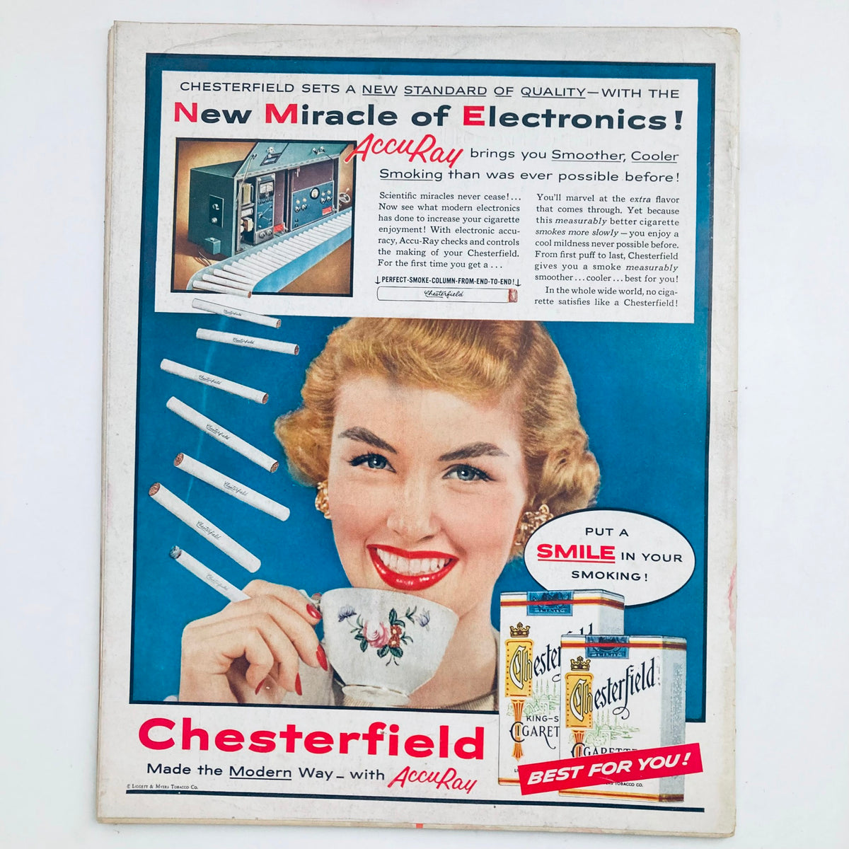 Vintage advertisement for Chesterfield cigarettes in VTG Look Magazine, October 4 1955, showcasing the new AccuRay technology with a smiling woman holding a teacup.