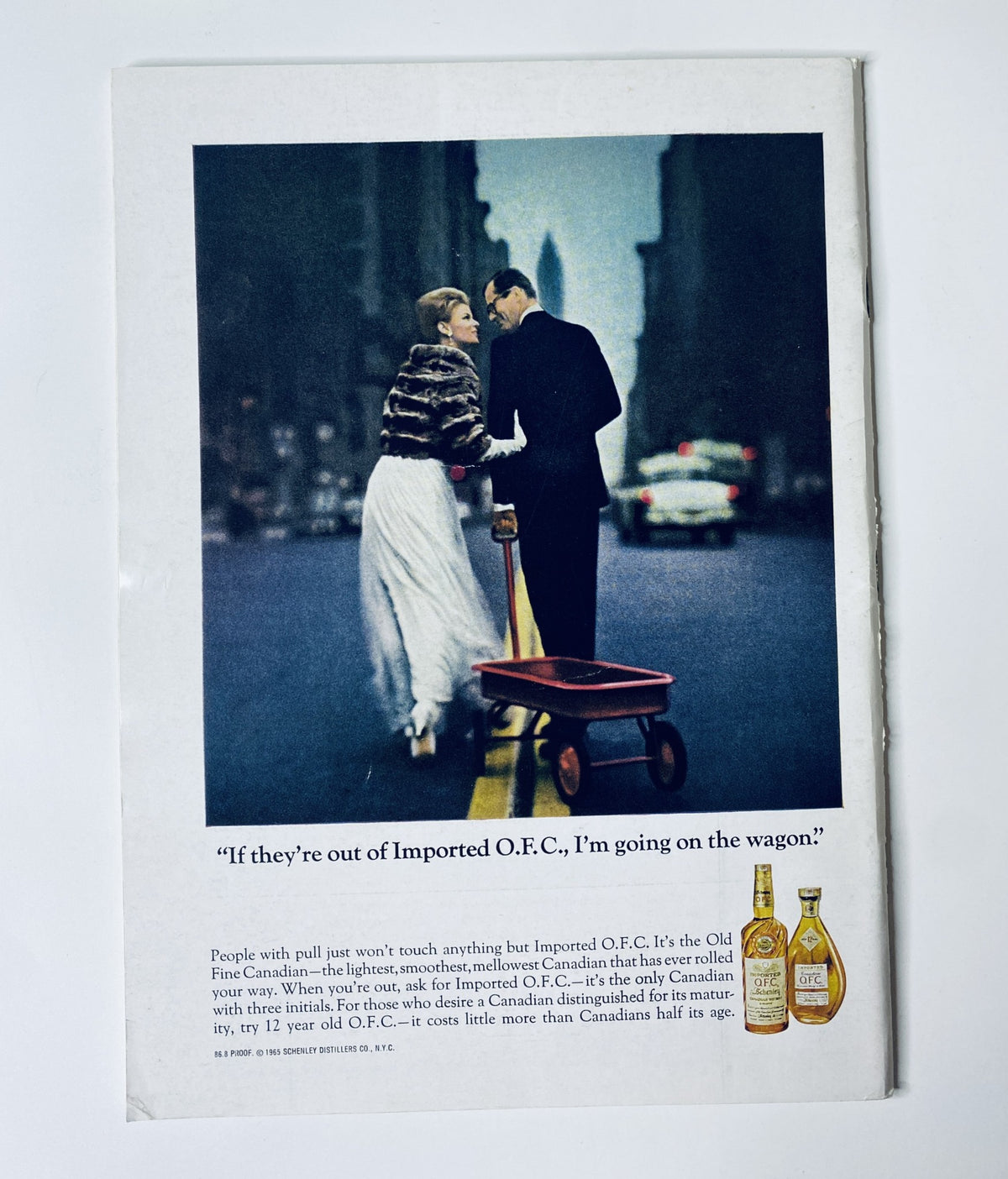 Vintage advertisement from The New Yorker Magazine January 15, 1966 featuring a couple walking with a wagon, promoting Imported O.F.C., alongside the Art Studio Painter cover by Charles Saxon.