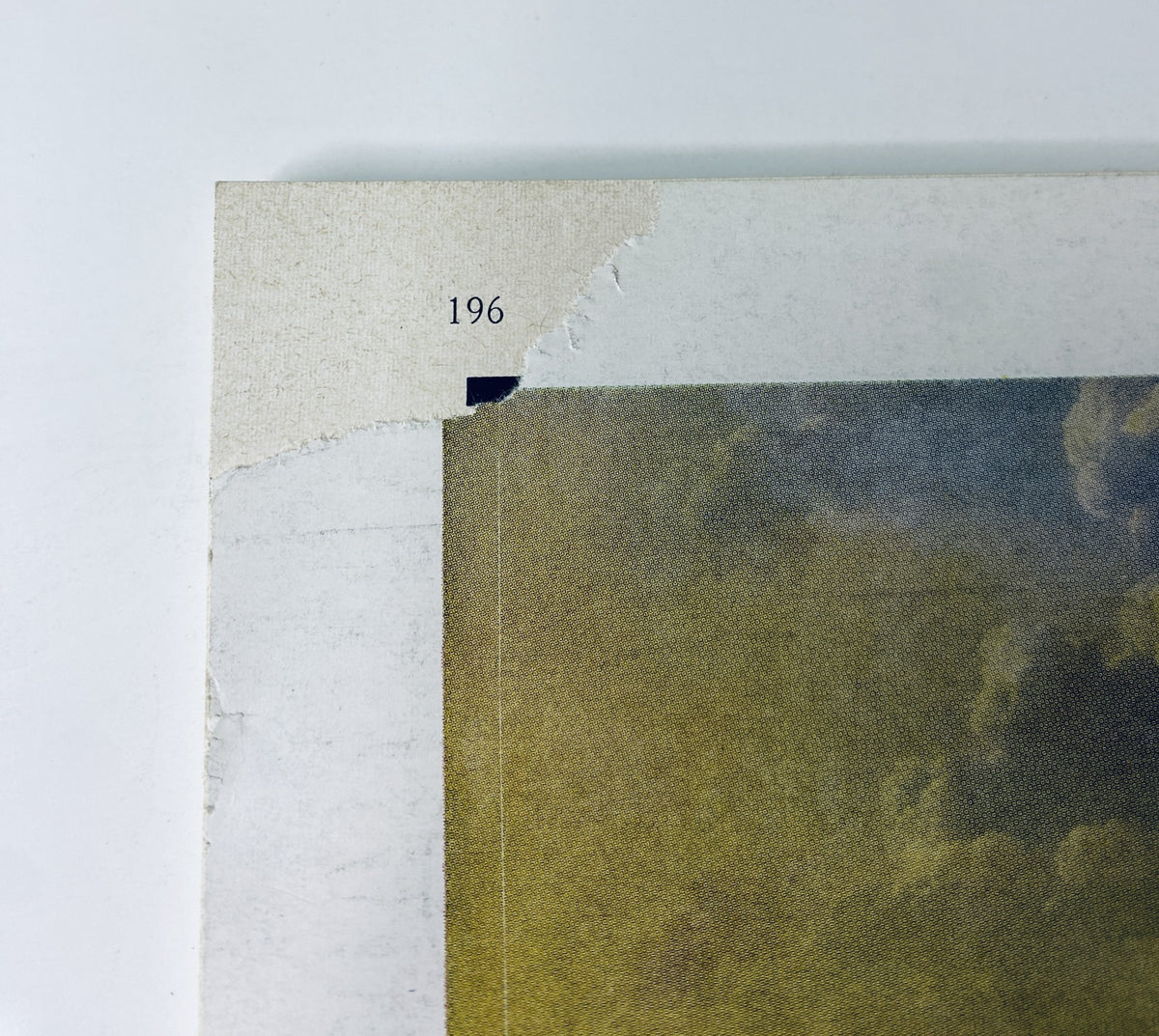 Close-up image of The New Yorker Magazine April 23, 1966 back cover showing a tear at the top corner.