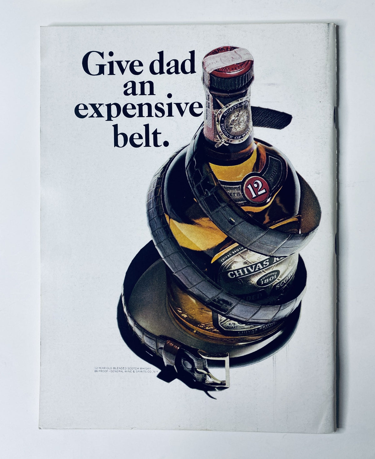 Advertisement from The New Yorker Magazine June 11, 1966, promoting luxury gifts with the tagline 'Give dad an expensive belt' featuring a bottle of Chivas Regal.