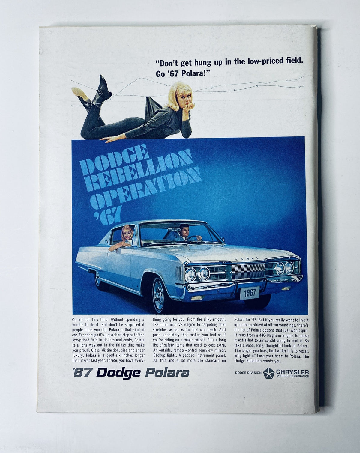 Vintage advertisement for the 1967 Dodge Polara from The New Yorker Magazine October 29, 1966, showcasing a white car with a stylish model, highlighting the message 'Don't get hung up in the low-priced field. Go '67 Polara!'