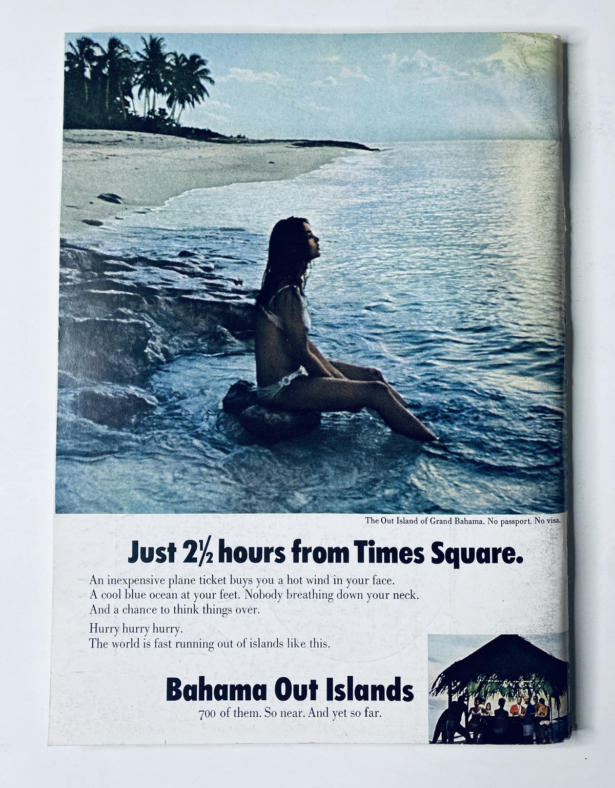 Advertisment in The New Yorker Magazine from November 25, 1967 for the Bahamas Out Islands, depicting a serene beach scene with a woman sitting by the water.