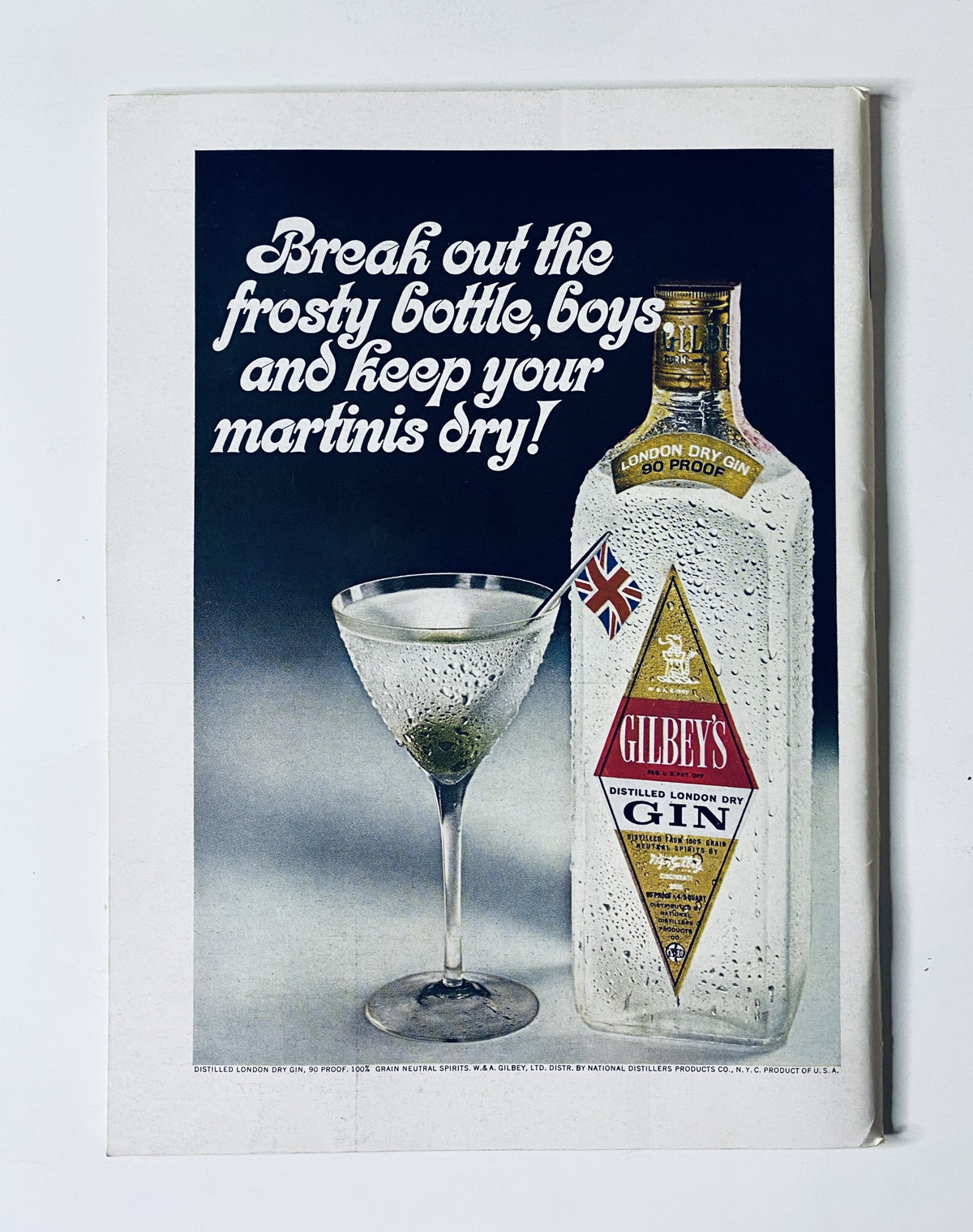 Advertisement in The New Yorker Magazine April 1, 1967 for Gilbey's Gin featuring a frosty bottle and a martini glass, promoting the message to enjoy martinis.