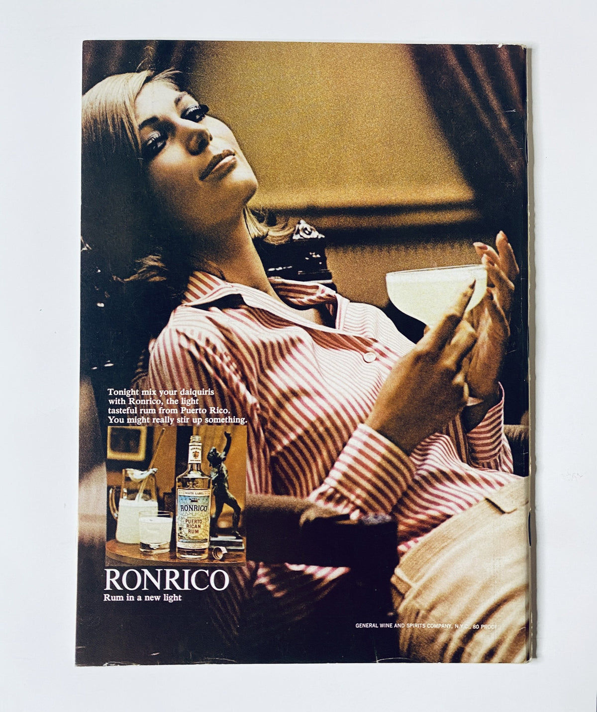 Advertisement for Ronrico rum in The New Yorker Magazine June 24, 1967, featuring a stylish woman relaxing with a cocktail, emphasizing the brand's sophisticated image.