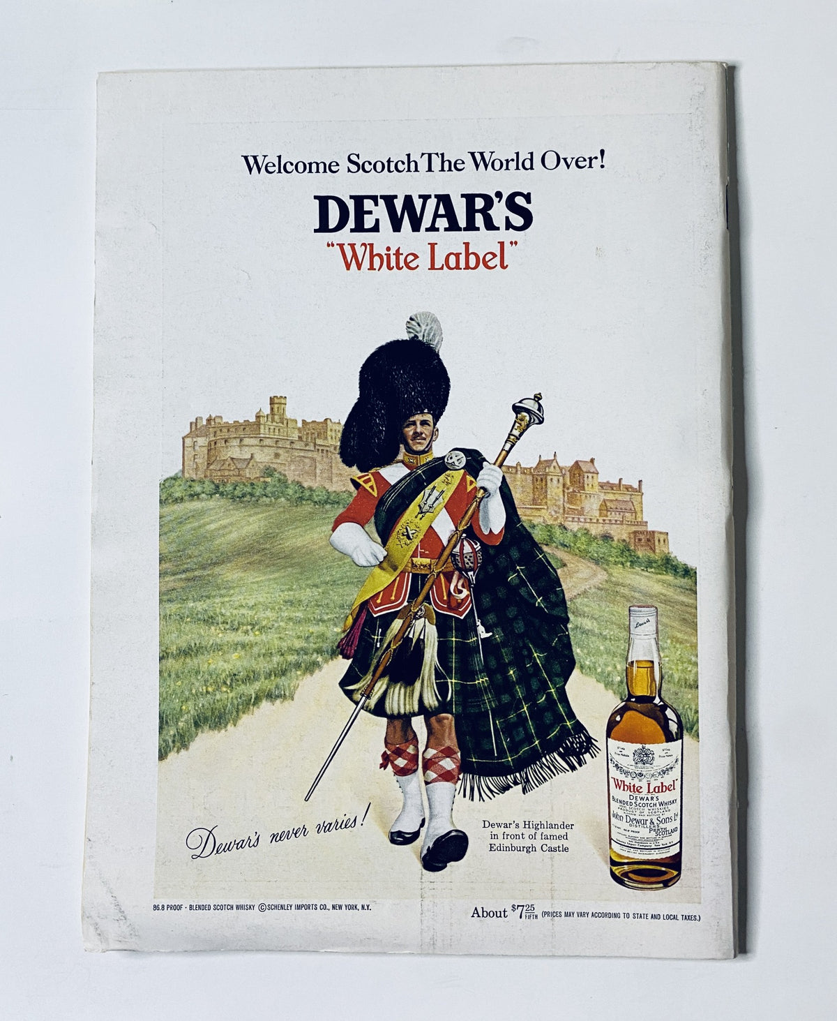 Dewar's 'White Label' Scotch whisky promotional advertisement featuring a Scottish bagpiper in traditional attire, inviting to enjoy Scotch, with the tagline 'Welcome Scotch The World Over!'