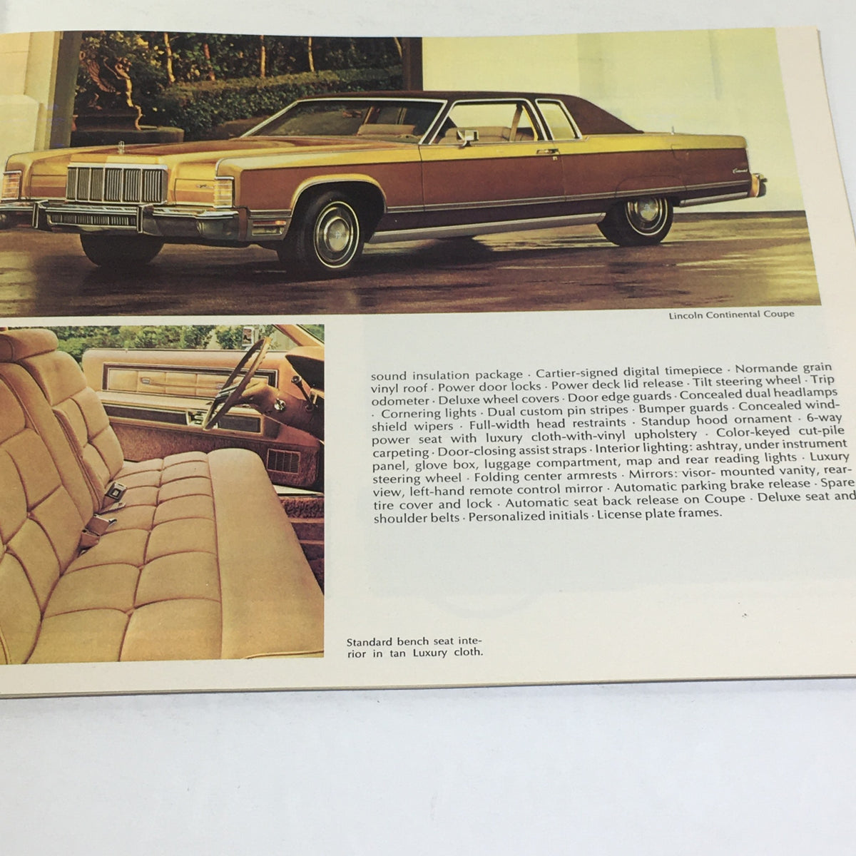 Interior view of a 1975 Lincoln Continental Coupe showcasing a luxurious tan vinyl interior, featured in the Vintage Lincoln-Mercury 1975 - Continental Sedan 460 V-8 Engine Car Brochure.
