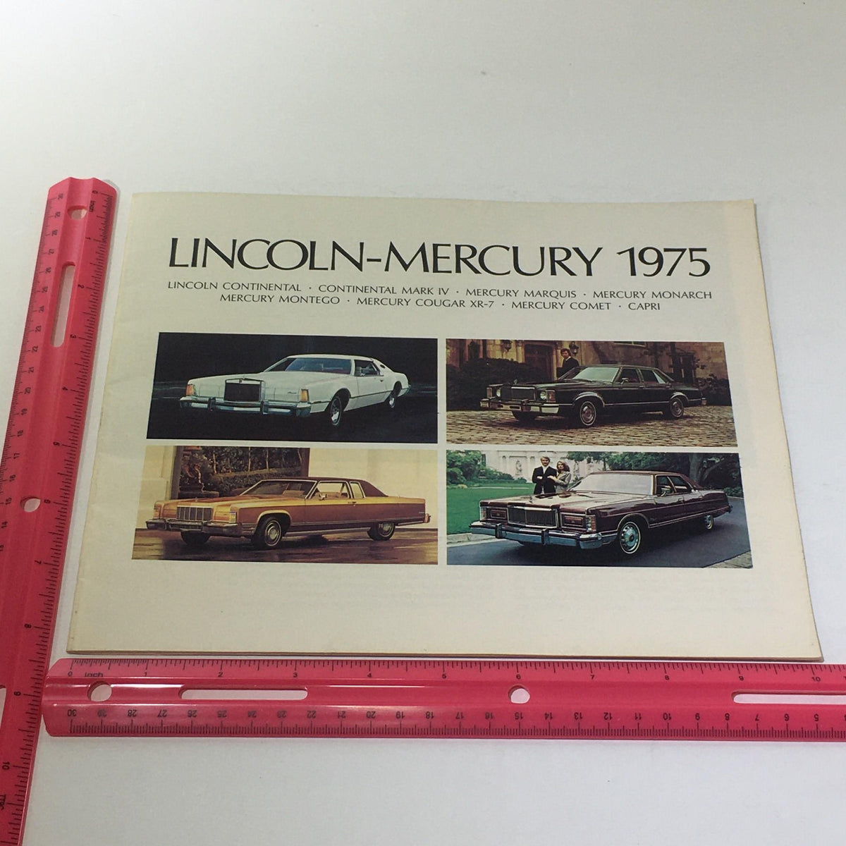 Cover page of the Lincoln-Mercury 1975 brochure featuring images of Lincoln Continental and various Mercury models, emphasizing the Vintage Lincoln-Mercury 1975 - Continental Sedan 460 V-8 Engine Car Brochure.