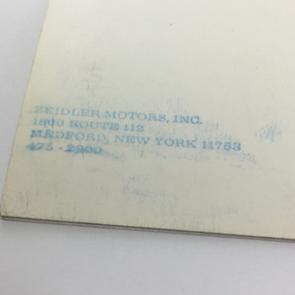 Detail of the Vintage The 1975 Continentals Town Coupe/Town Car/Mark IV Car Catalog Brochure showing a stamp from Zeidler Motors, Inc. in New York.