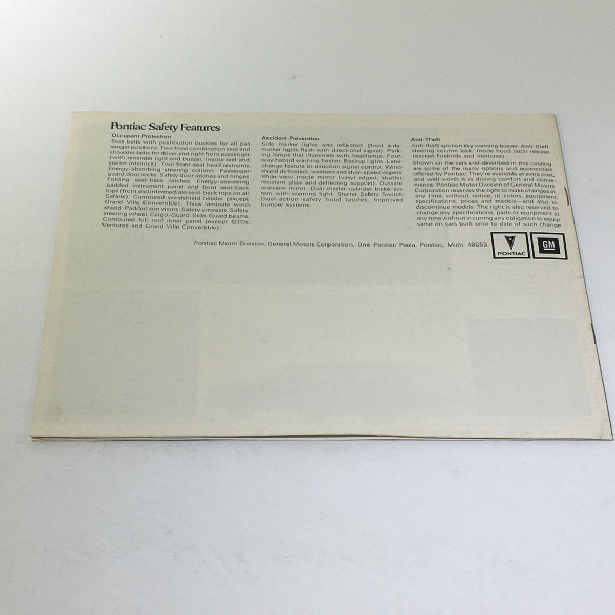 Back cover of the 1974 Pontiac Grand Ville 4-Door Hardtop V-8 Sedan Car Auto Catalog Brochure, detailing Pontiac safety features.
