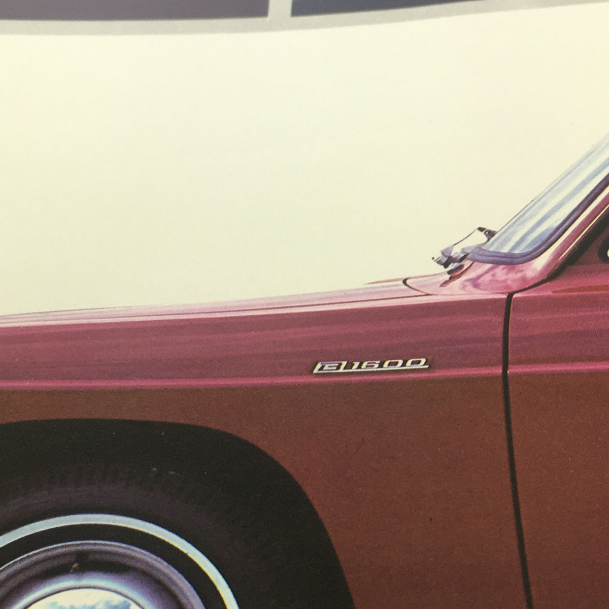 Close-up image of the 1975 Mazda B1600 pickup truck showing the vehicle's model badge and exterior details from the 1975 Mazda B1600 Pickup Sport Truck Car Auto Brochure Catalog.