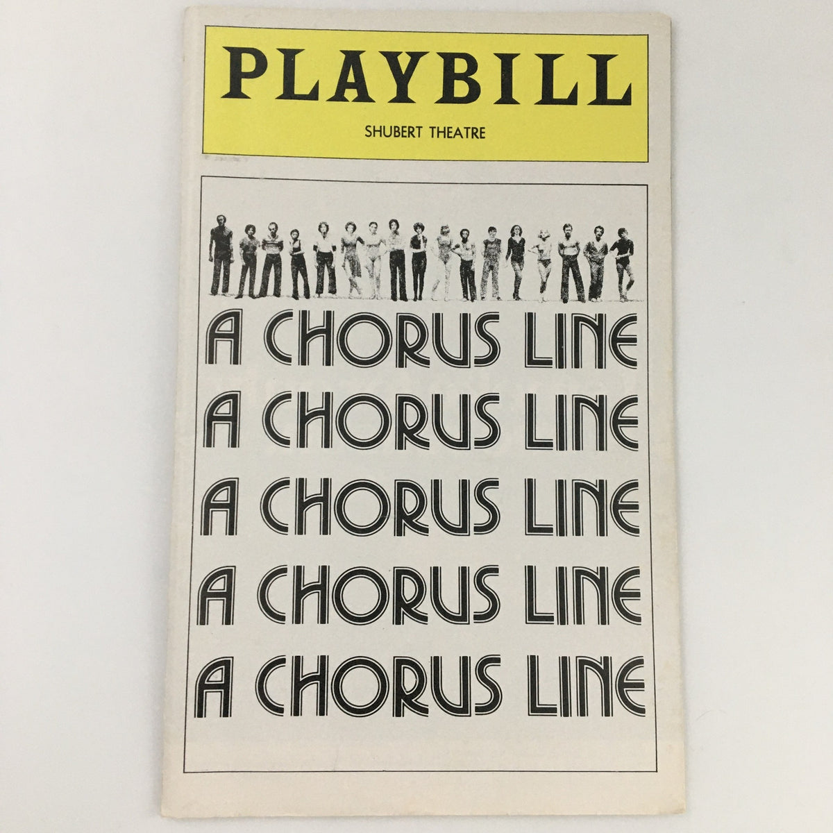 1976 Playbill for 'A Chorus Line' at Shubert Theatre featuring dance cast and iconic title design.