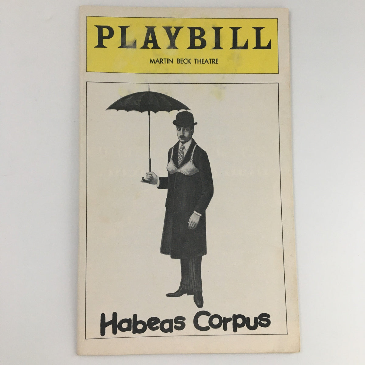 1975 Playbill for 'Habeas Corpus' at Martin Beck Theatre featuring a character in a hat holding an umbrella.