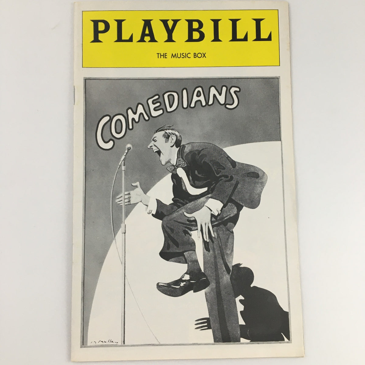 1977 Playbill for The Music Box production 'Comedians' featuring artwork of a comedian performing on stage.
