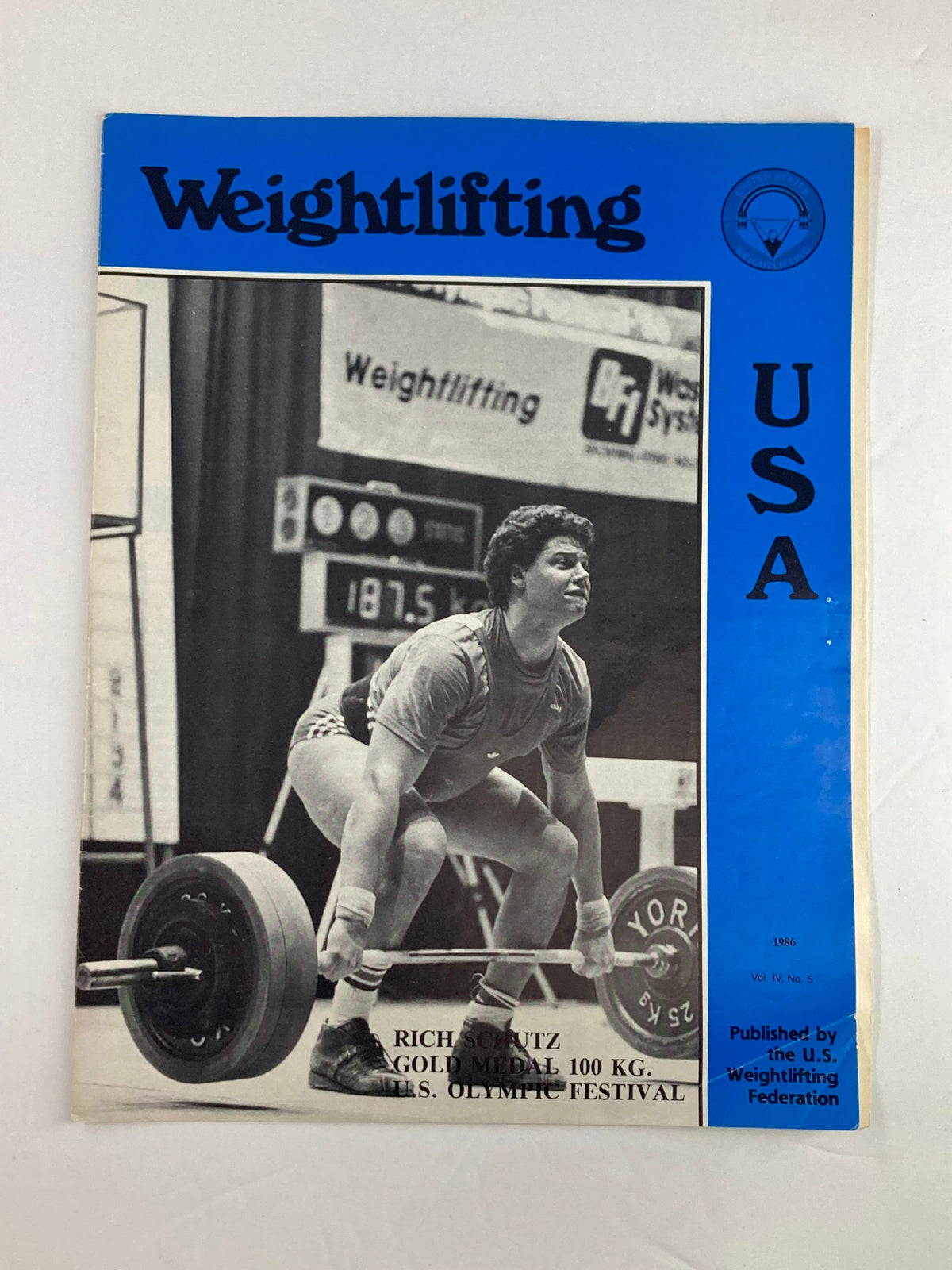 Cover of the VTG Weightlifting USA Magazine 1986 Vol 4 #5 featuring Rich Schutz who won the Gold Medal in the 100 kg category at the U.S. Olympic Festival.
