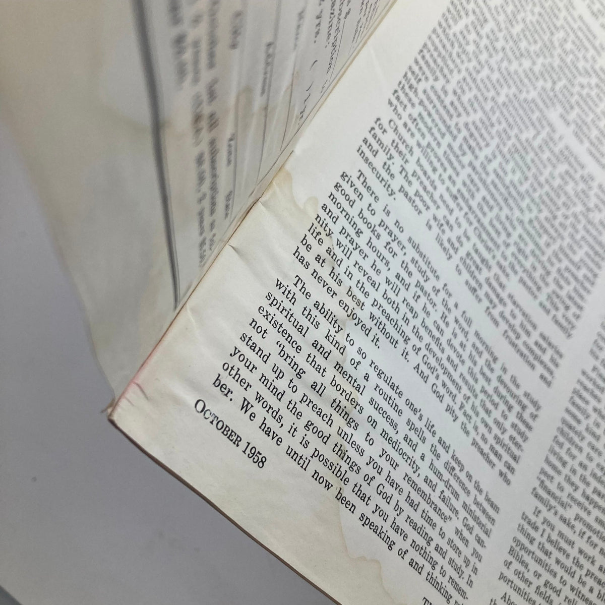 Close-up view of the text in the VTG The Preacher's Sermon Builder Magazine October 1958, revealing some water damage and detailing on the pages.