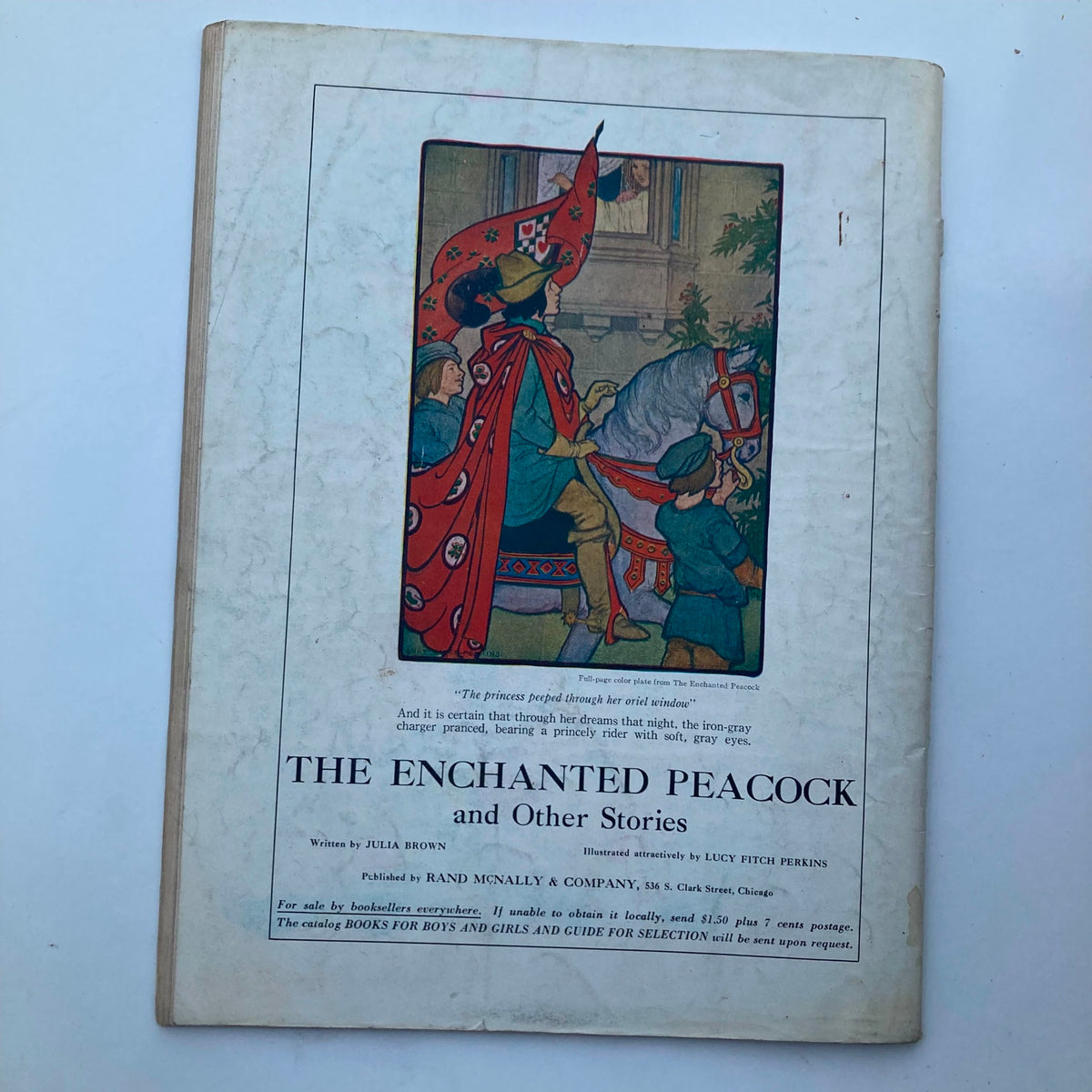 Back cover of VTG Child Life Magazine August 1927 featuring the book 'The Enchanted Peacock and Other Stories' illustrated by Lucy Fitch Perkins.