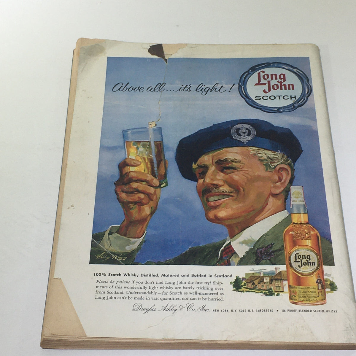 Back cover of The New Yorker: October 4, 1958 featuring an advertisement for Long John Scotch, with a smiling man raising a glass.