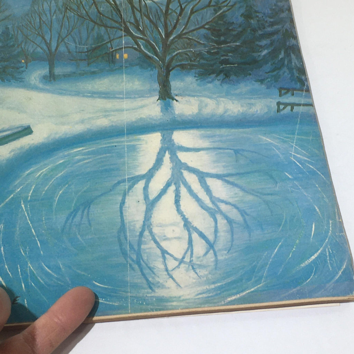 Detail view of the winter scene cover of The New Yorker: February 28, 1959, illustrating the reflection of trees in an icy pond, created by Edna Eicke.
