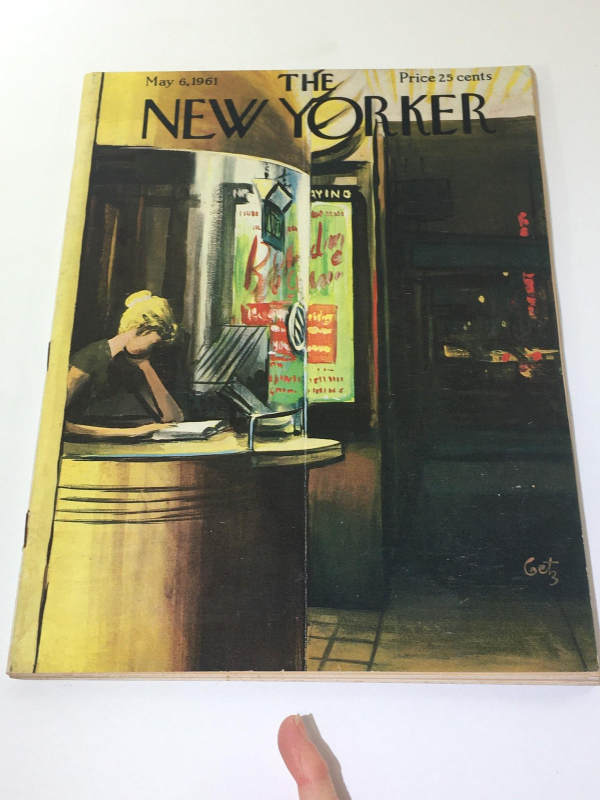 The New Yorker magazine cover from May 6, 1961, showcasing Arthur Getz's illustration of a woman at a counter, encapsulating the essence of the era with urban themes and nostalgic charm.