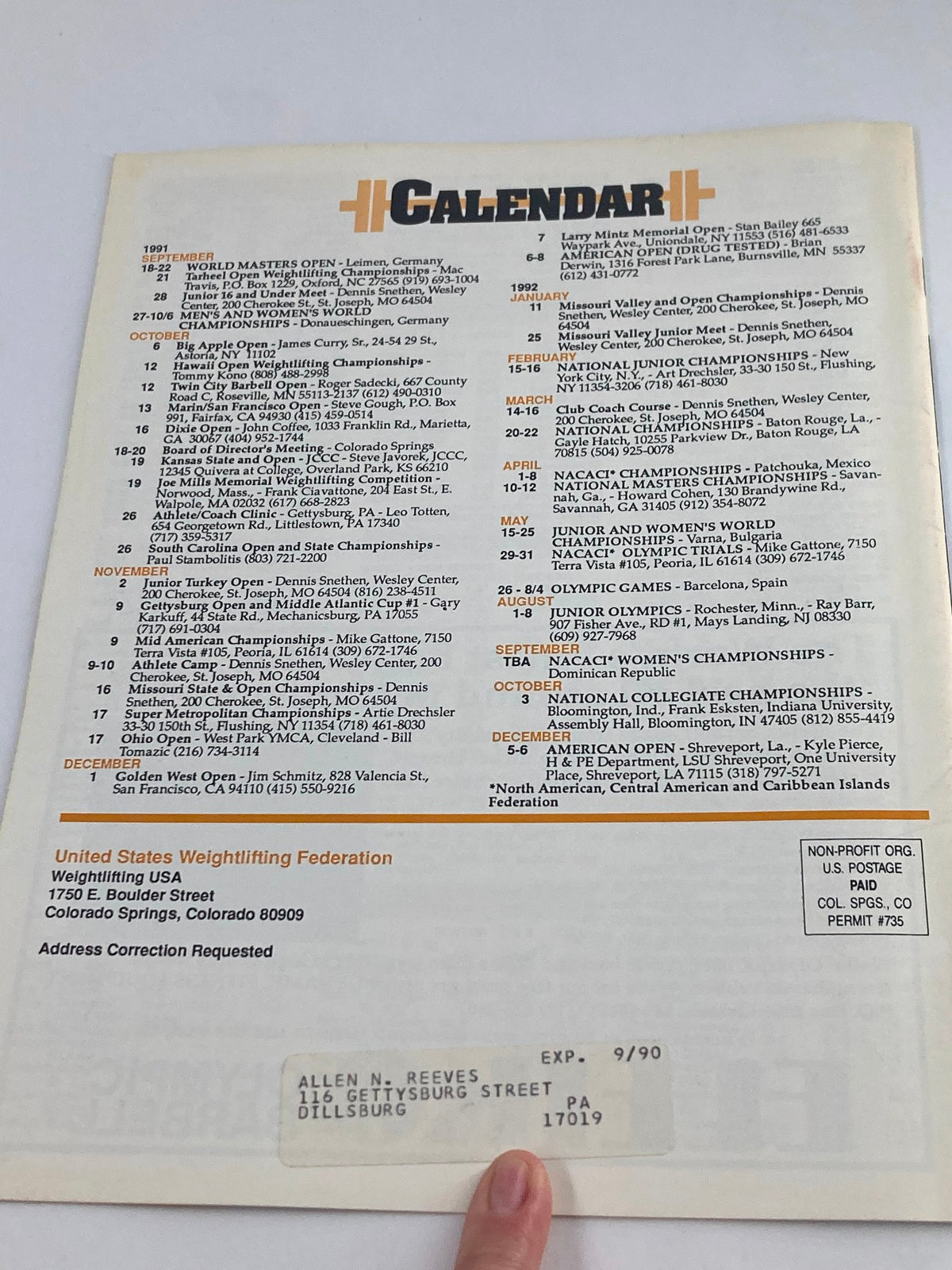 Calendar page from the 1991 VTG Weightlifting USA Magazine Vol 9 #4 featuring events including the World Masters Open and various weightlifting championships, showcasing the timeline of competitions and key information pertinent to the sport. This magazine highlights Wes Barnett's gold win at the Festival.