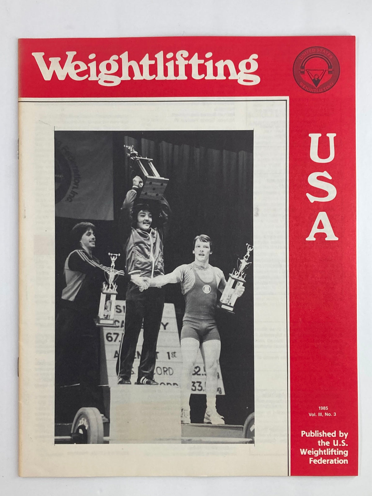 Vintage Weightlifting USA Magazine Vol 3 #3 from 1985, featuring athletes on the cover and showcasing Brian Miyamoto winning a trophy.