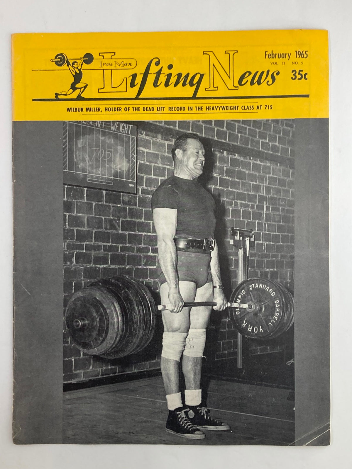 VTG Iron Man Lifting News Vol 11 #5 February 1965 featuring Wilbur Miller on the cover, showcasing him lifting weights. This vintage magazine highlights the fitness culture of the 1960s.