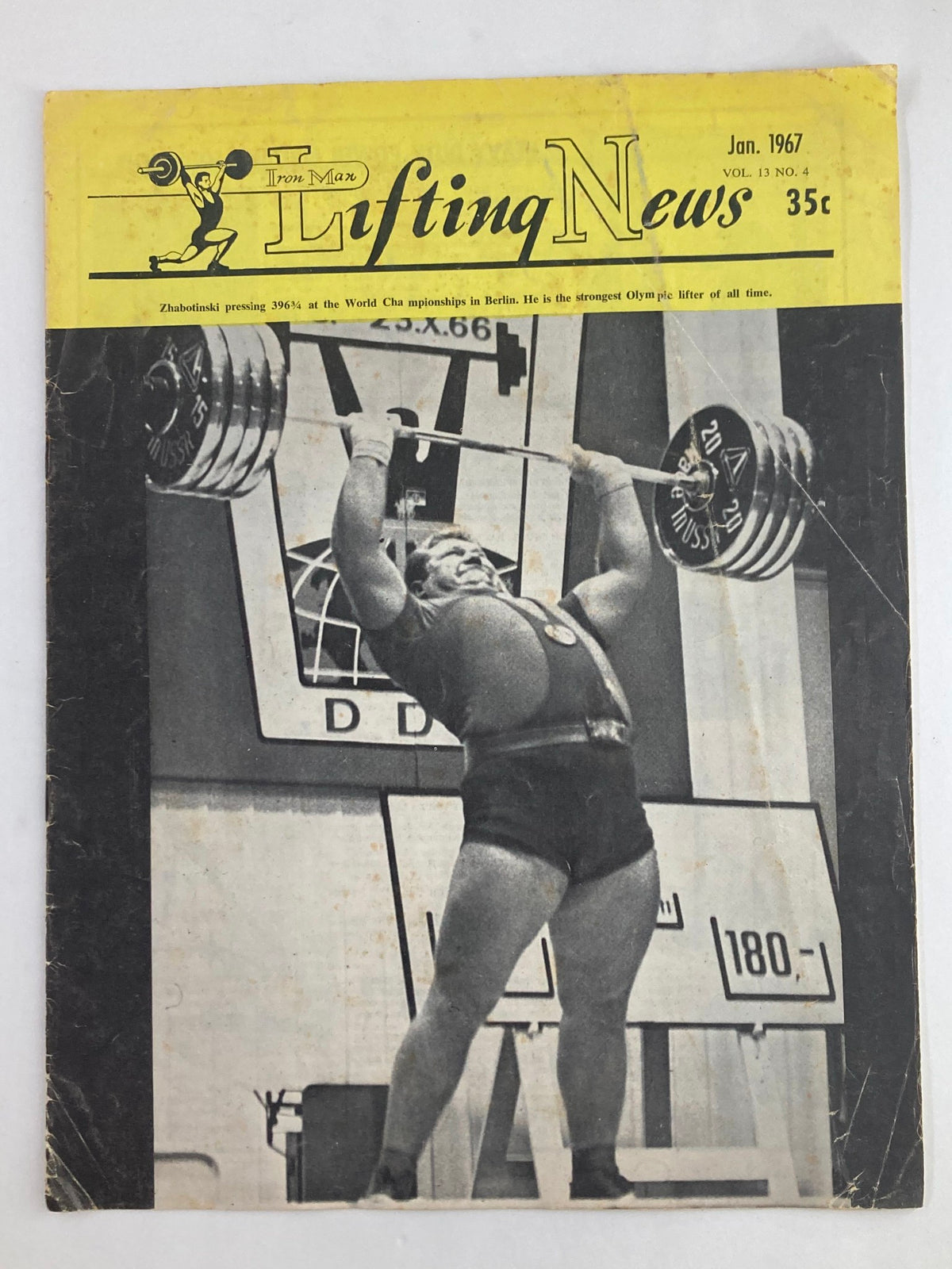 Cover of VTG Iron Man Lifting News Vol 13 #4 January 1967 featuring Leonid Zhabotinski lifting weights at the World Championships, showcasing the strength of Olympic lifters.