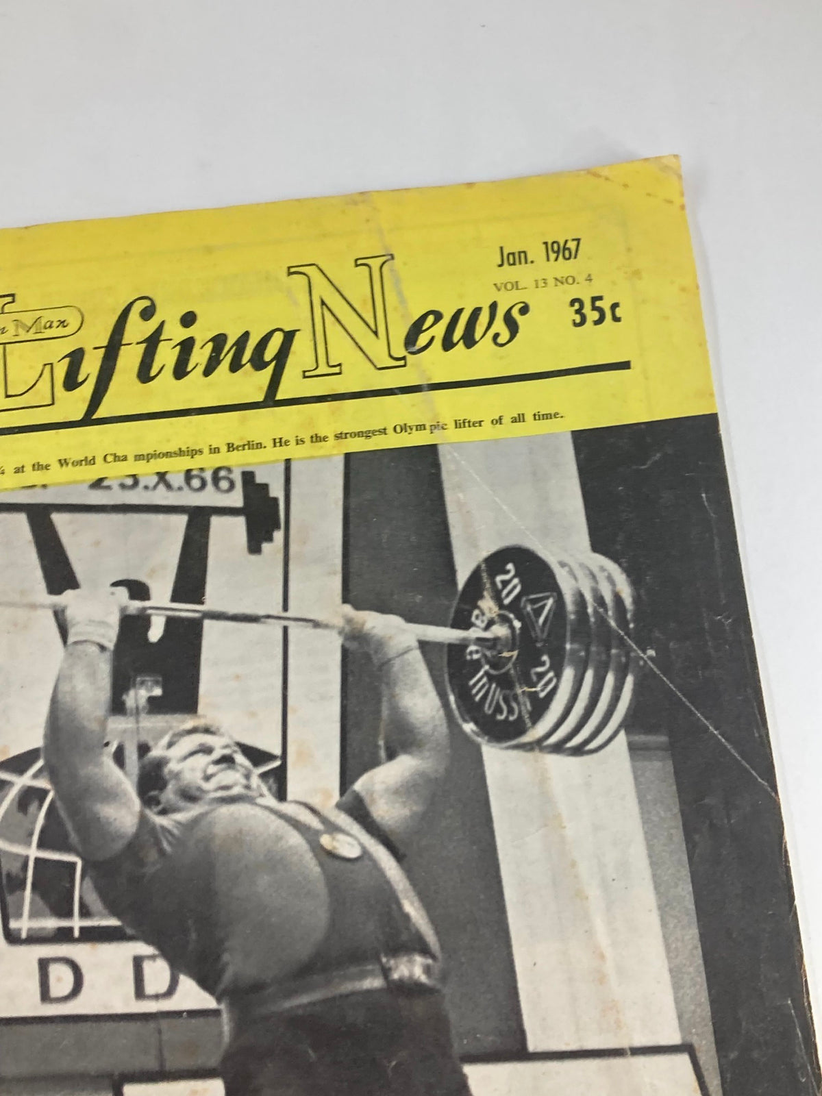 Another angle of the cover of VTG Iron Man Lifting News Vol 13 #4 January 1967, featuring Leonid Zhabotinski in action as he lifts weights during a competition.