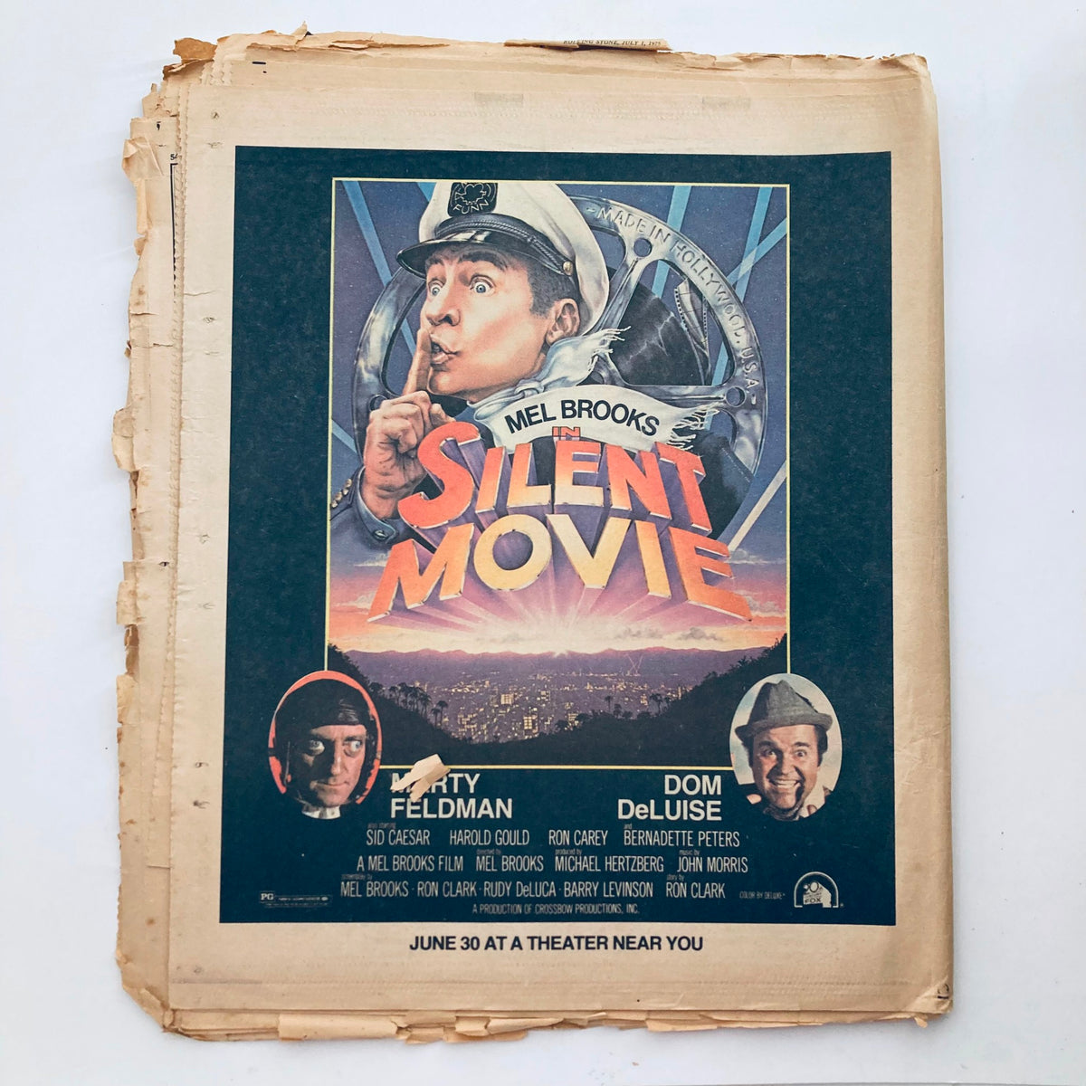 Vintage poster for Mel Brooks' film 'Silent Movie' featuring artwork with the tagline, 'June 30 at a theater near you.' The poster showcases comedic elements and characters, ideal for collectors of classic film memorabilia.