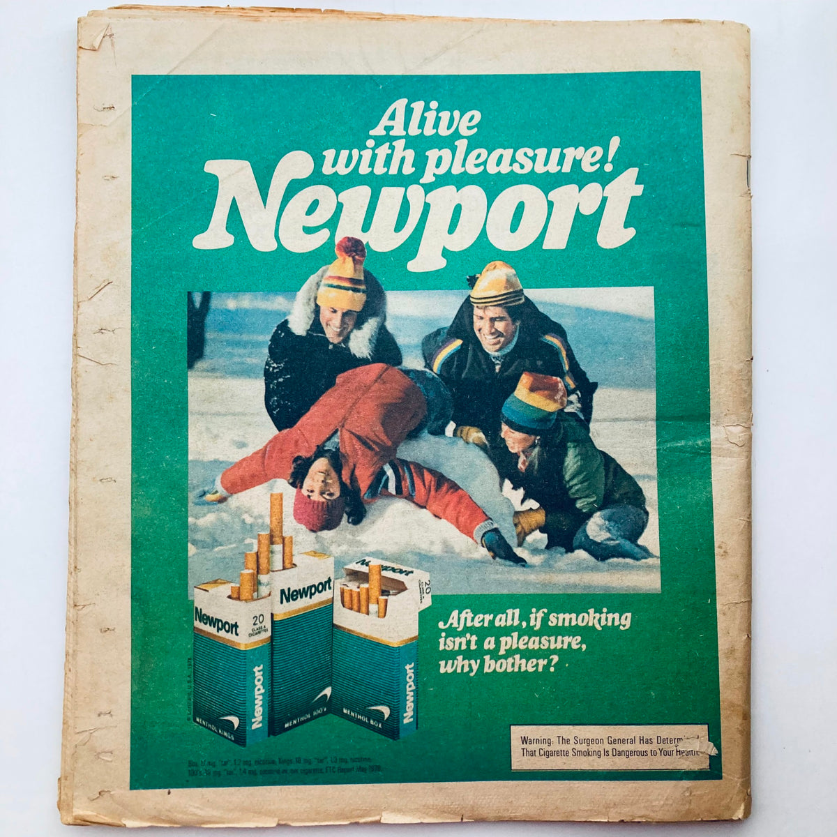 Vintage advertisement for Newport cigarettes featuring a winter scene with people playing in the snow, alongside the slogan 'Alive with pleasure!' from Vintage Rolling Stone Magazine January 25 1979.