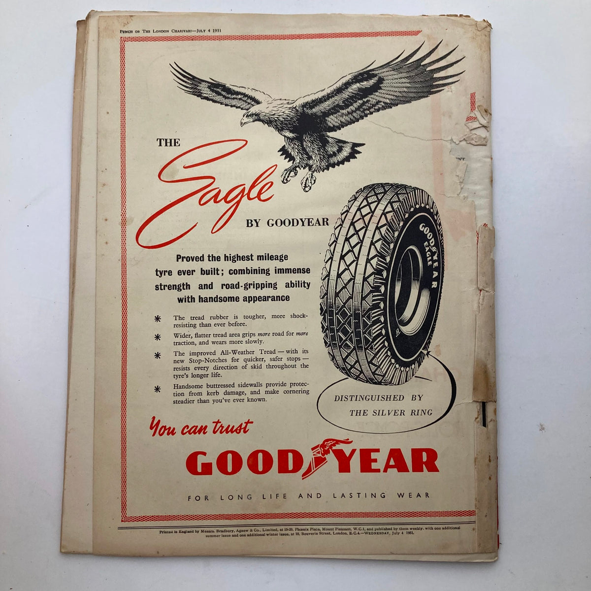 Goodyear tire advertisement from Punch Magazine July 4 1951, illustrating the features and benefits of the Eagle tire model.